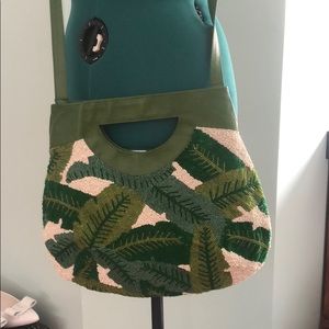 Ivy/ green handbag with handle and strap.